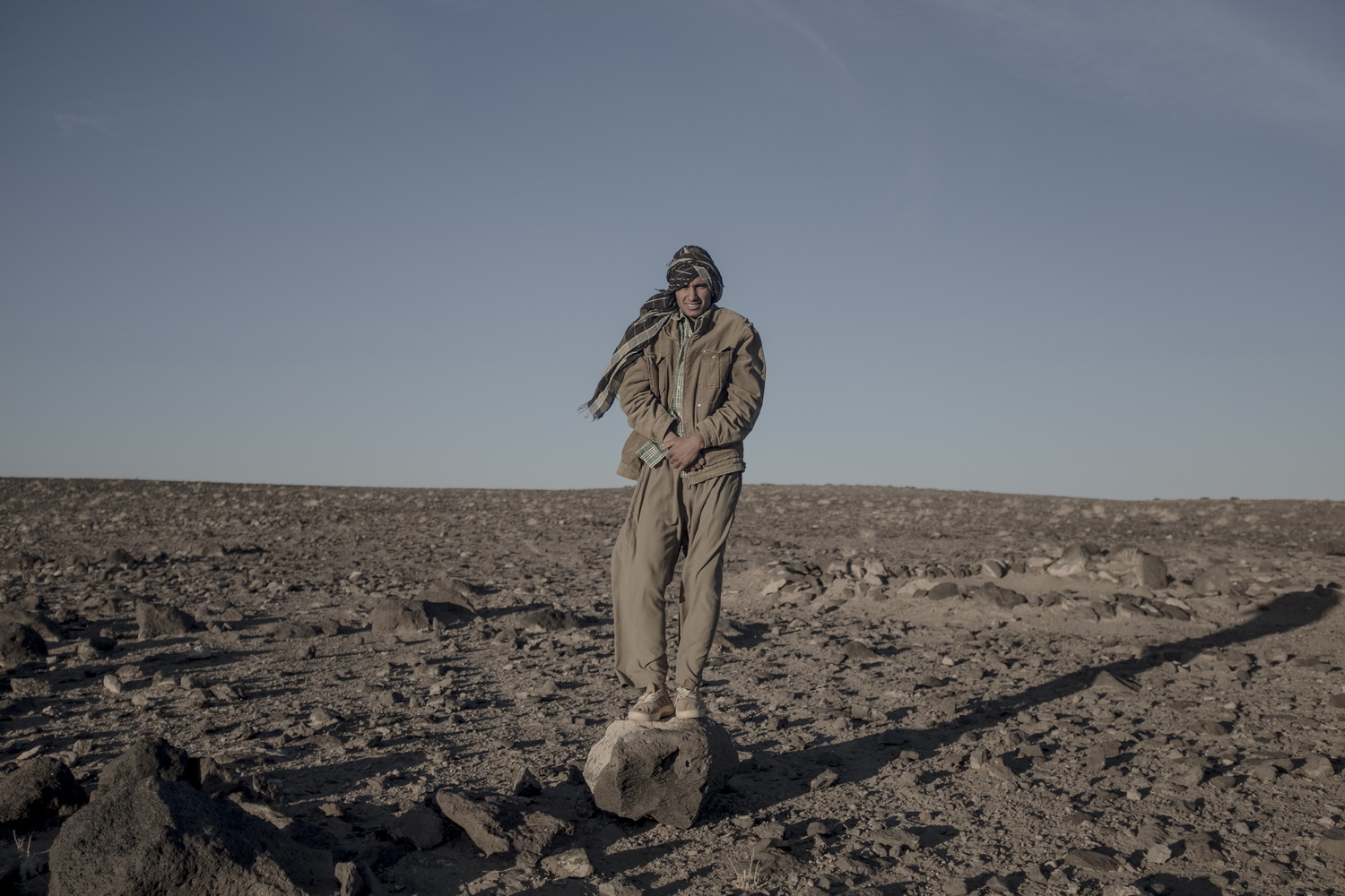 man standing on stone