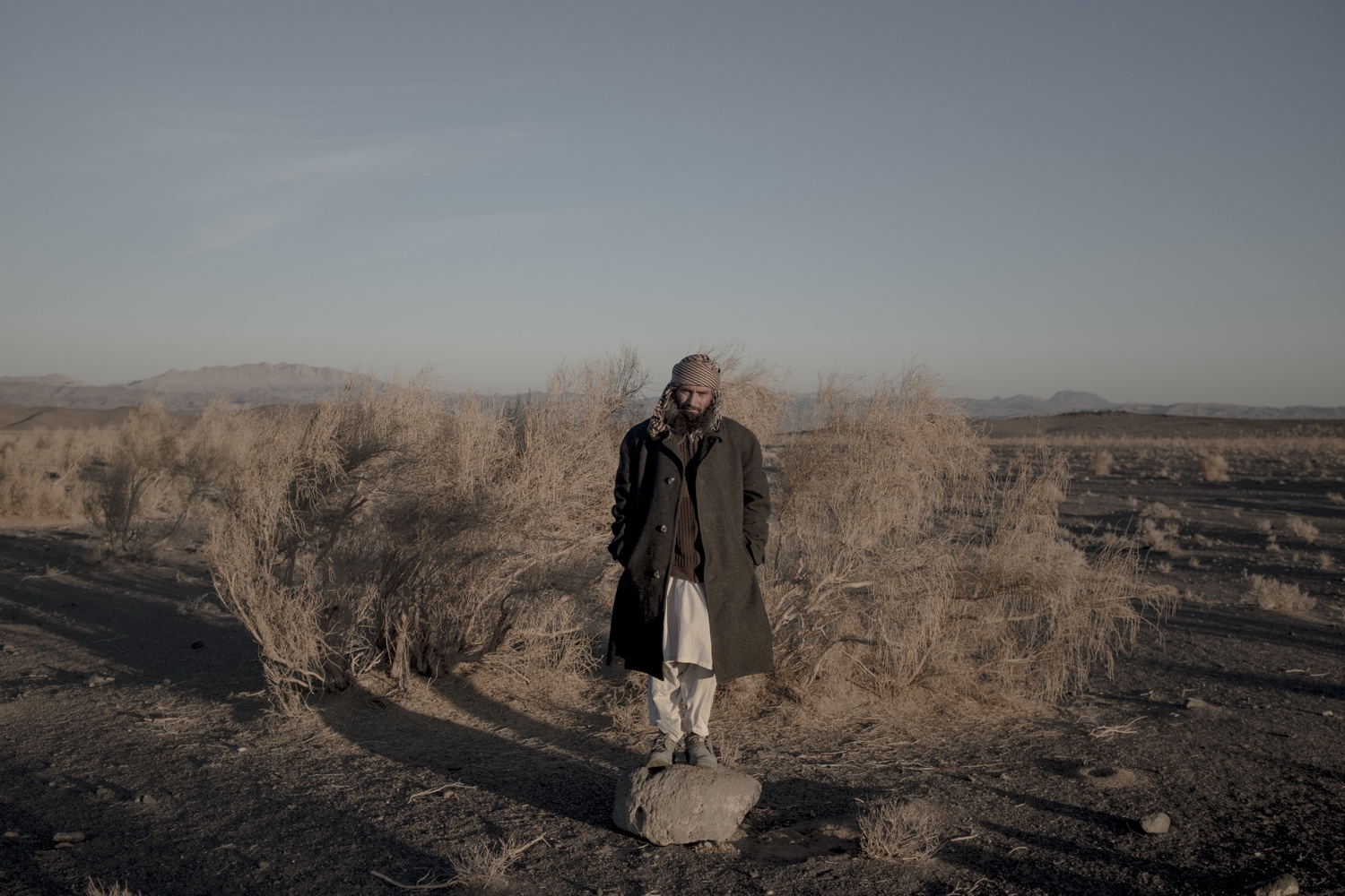 man standing on stone